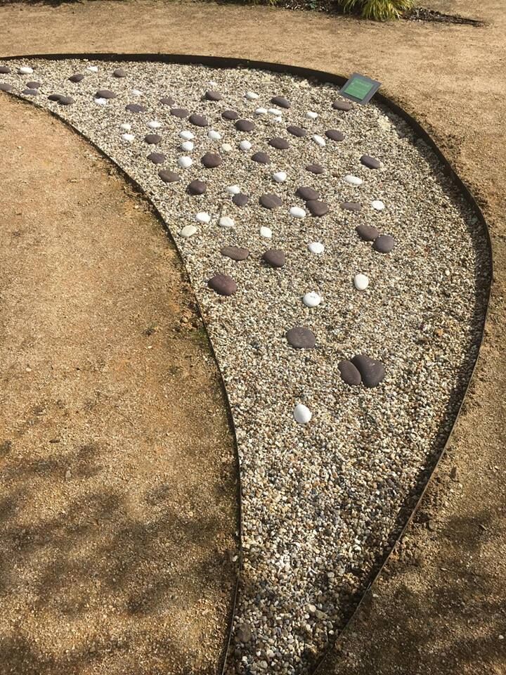 The moon bed in our Memorial Garden, laid with engraved pebbles