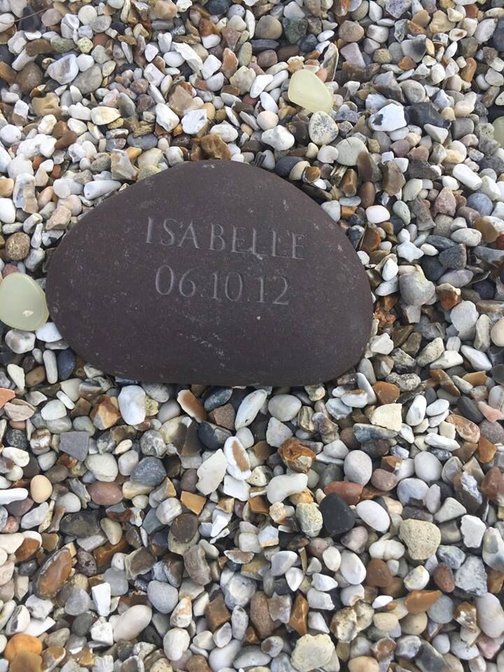 An engraved memorial pebble